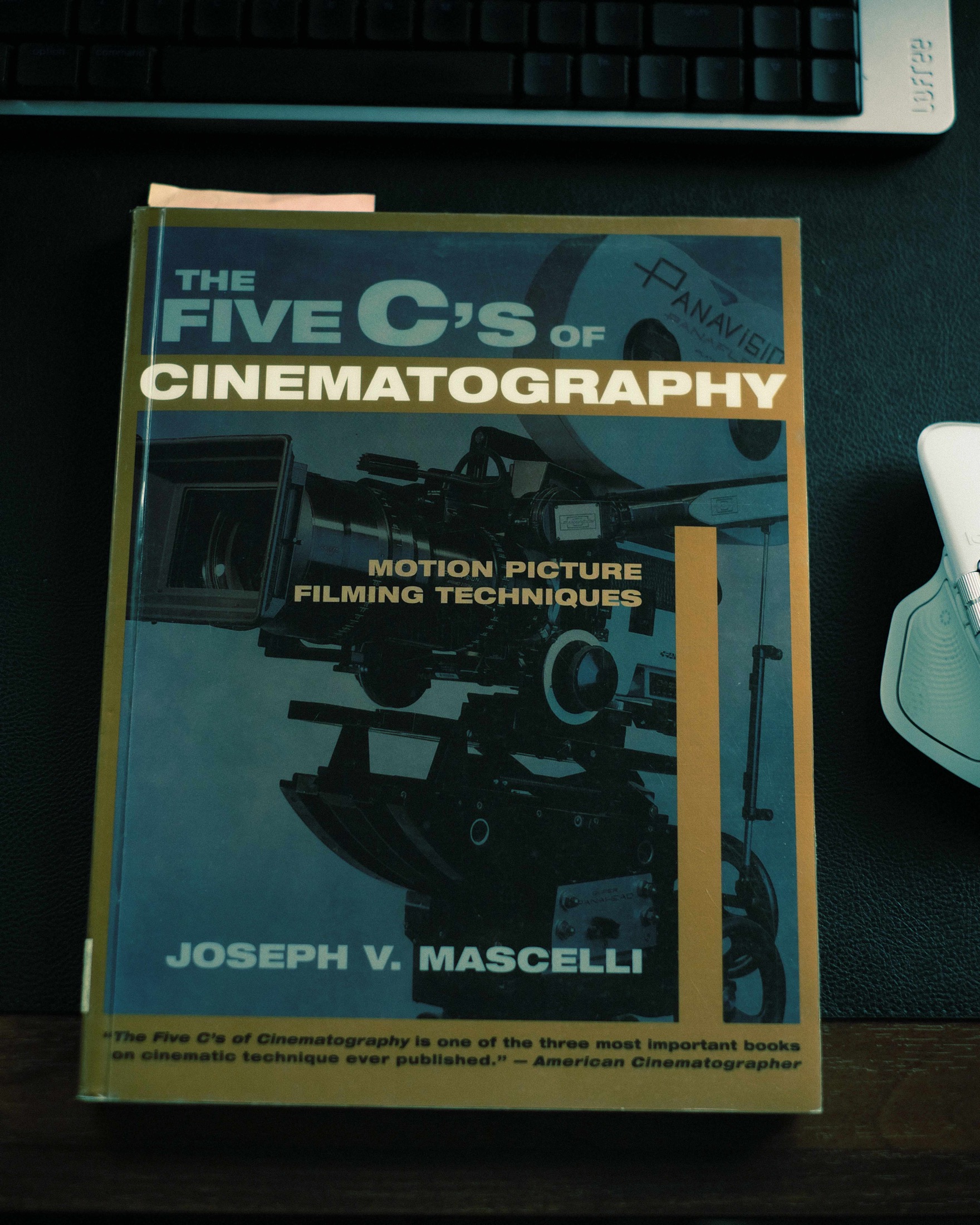 The Five C's of Cinematography by Joseph V. Mascelli photographed beside a keyboard