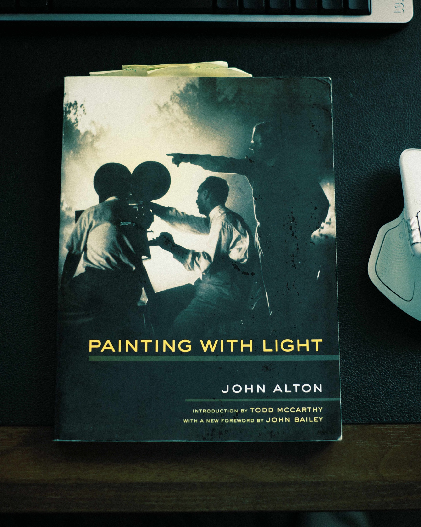 A worn copy of Painting with Light by cinematographer John Alton on a desk