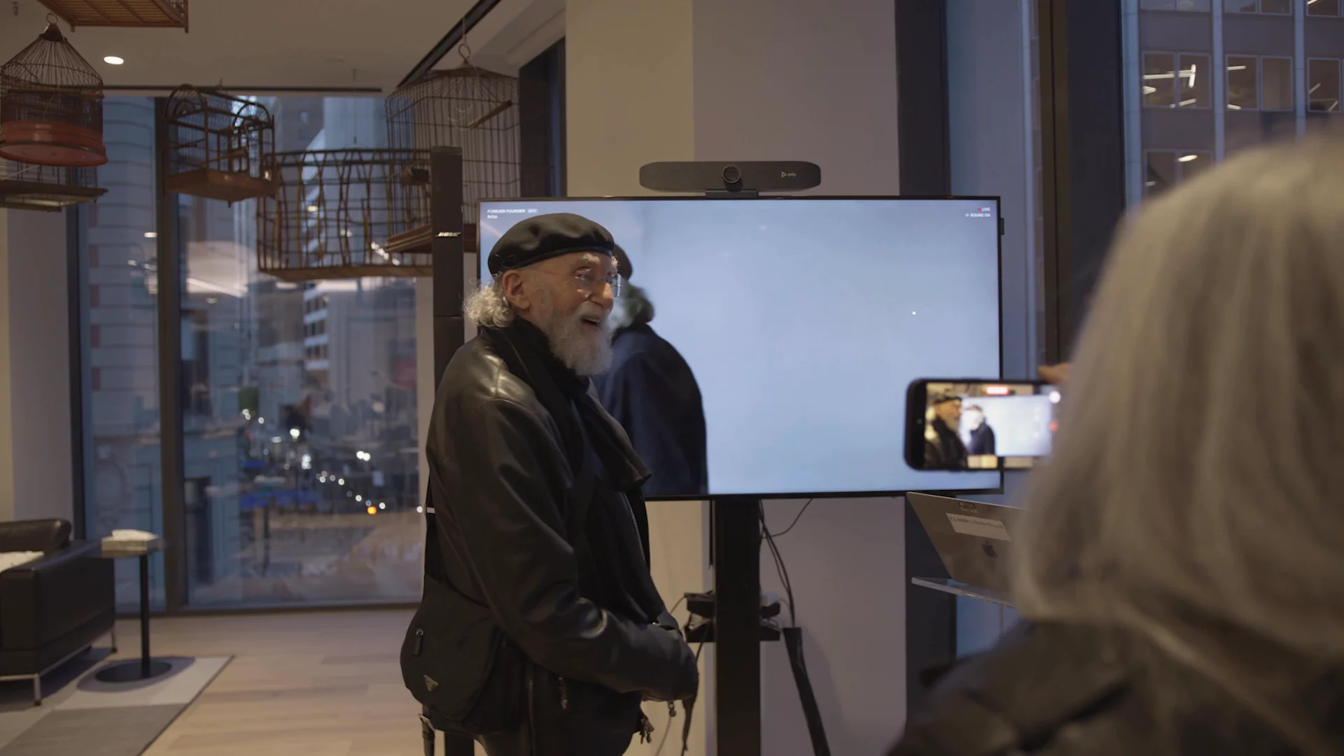Bob Greenberg at the R/GA book event with the Forever Founder avatar visible on a screen behind him