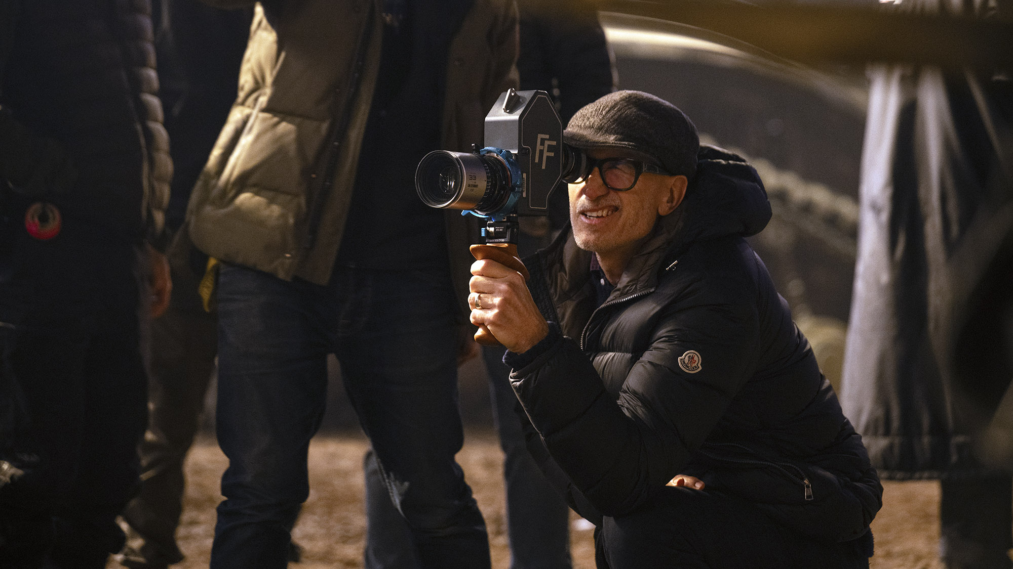 Director Craig Gillespie holding a cinema camera while filming Supergirl